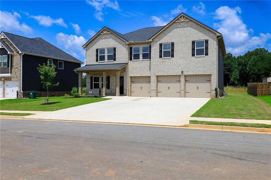Front exterior of a new home in , McDonough, GA, highlighting curb appeal (Image 1).