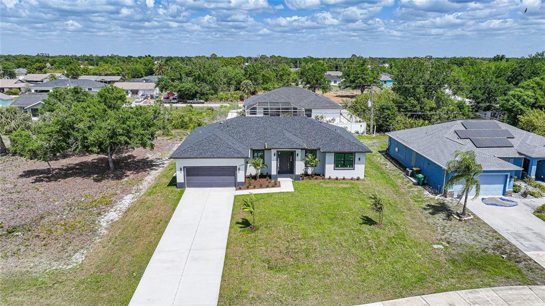 Front exterior of a new home in , Englewood, FL, highlighting curb appeal (Image 25).