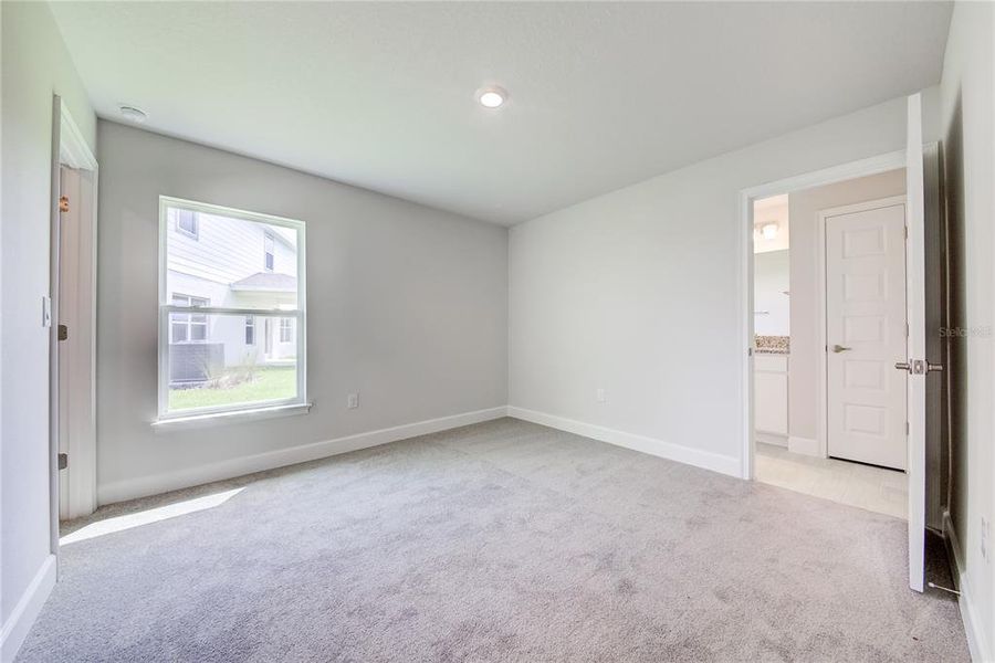 Spacious, unfurnished interior of a new home in Aviary at Rutland Ranch, Parrish (Image 17).
