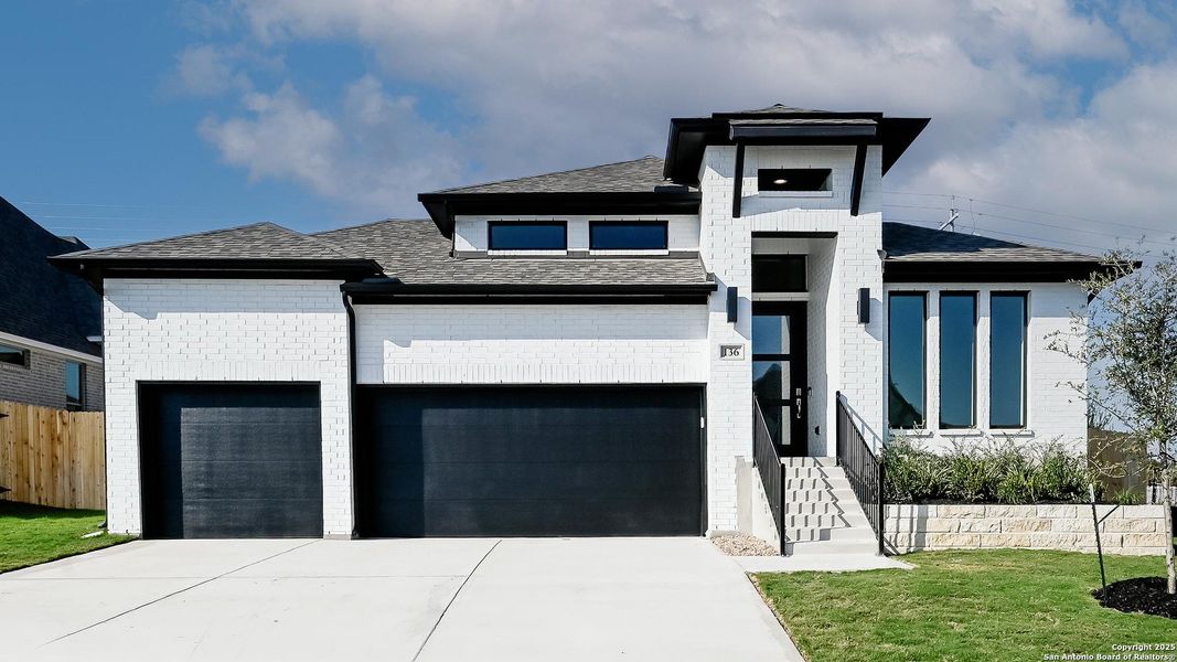 Front exterior of a new home in Cibolo Valley Heights 65', Cibolo, TX, highlighting curb appeal (Image 14).