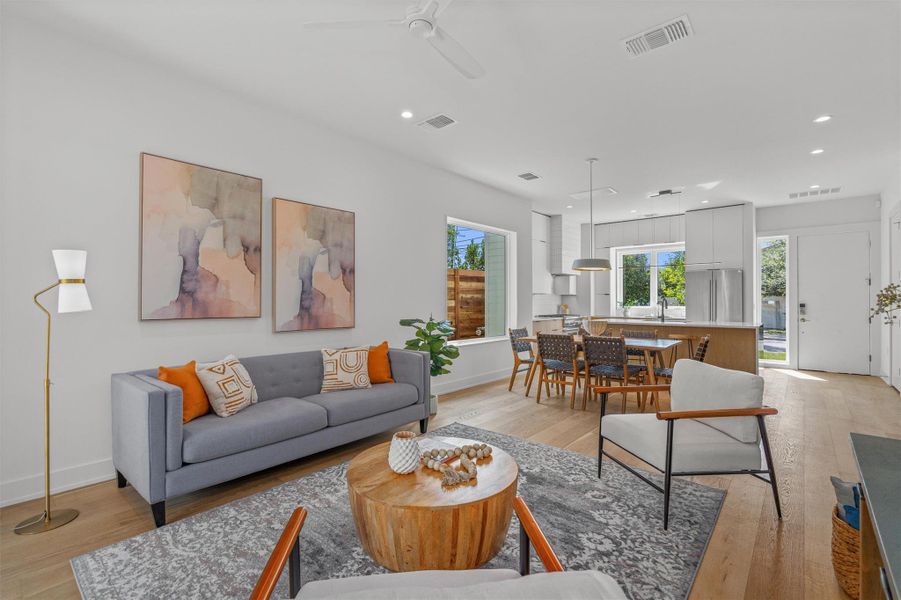 Thoughtfully designed with wide plank wood floors and striking display windows throughout, the home is filled with natural light and architectural character. Thoughtfully designed with wide plank wood floors and striking display windows throughout, the home is filled with natural light and architectural character.