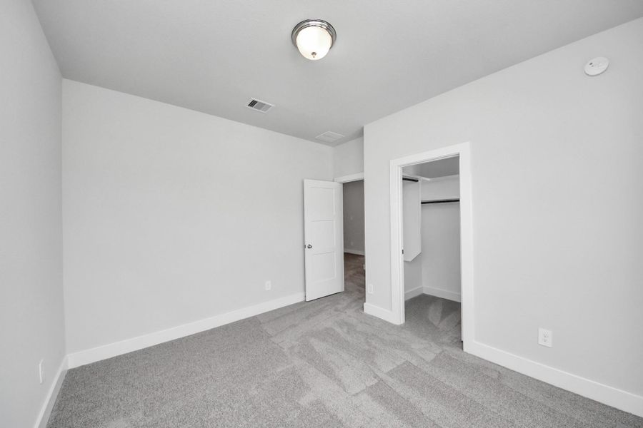 Spacious, unfurnished interior of a new home in Amira: Premier Collection, Tomball (Image 11).