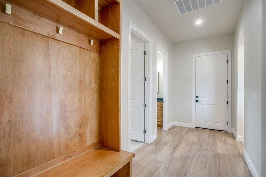 Mudroom featuring light wood-style flooring and recessed lighting Mudroom featuring light wood-style flooring and recessed lighting