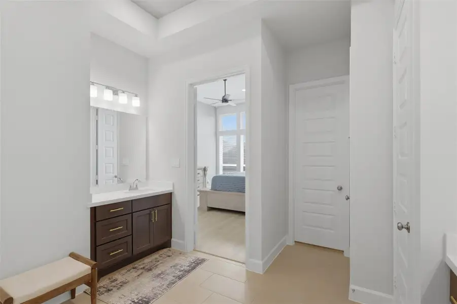Double vanity provides generous counterspace and storage in the primary bath. Double vanity provides generous counterspace and storage in the primary bath.