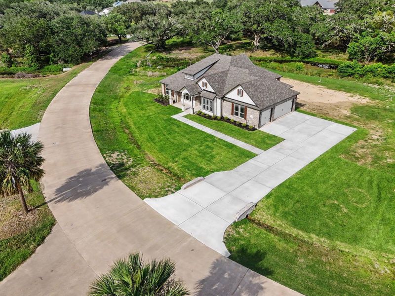 Front exterior of a new home in , Bay City, TX, highlighting curb appeal (Image 17).