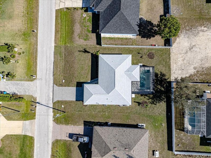 Front exterior of a new home in Cape Coral, Cape Coral, FL, highlighting curb appeal (Image 24). Front exterior of a new home in Cape Coral, Cape Coral, FL, highlighting curb appeal (Image 24).