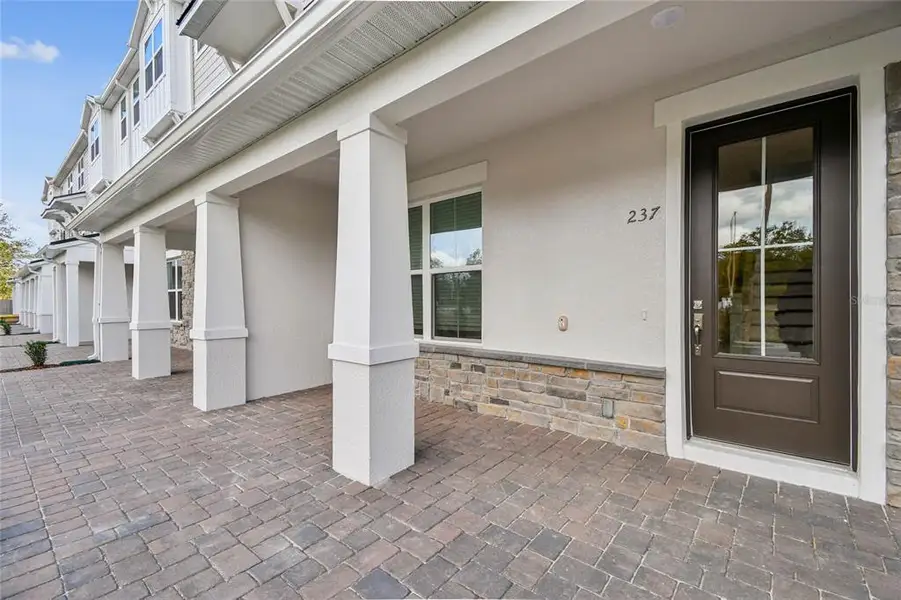 Exterior details and patio area of a home in Townes at Northlake, Oviedo (Image 3).