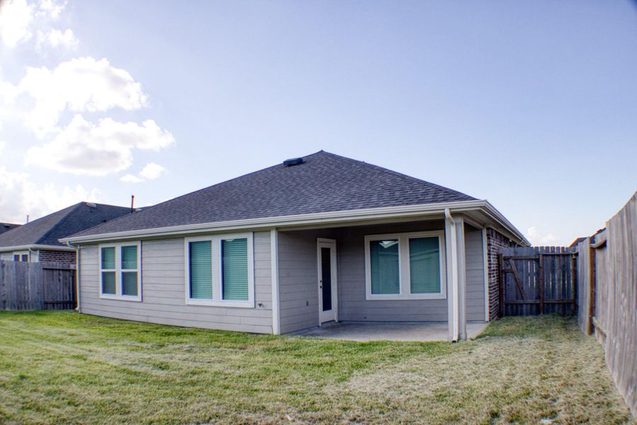 Front exterior of a new home in Central Park, Texas City, TX, highlighting curb appeal (Image 14). Front exterior of a new home in Central Park, Texas City, TX, highlighting curb appeal (Image 14).