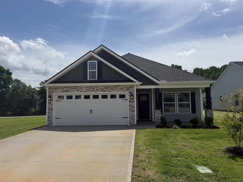 Front exterior of a new home in Stones Throw, Inman, SC, highlighting curb appeal (Image 2). Front exterior of a new home in Stones Throw, Inman, SC, highlighting curb appeal (Image 2).