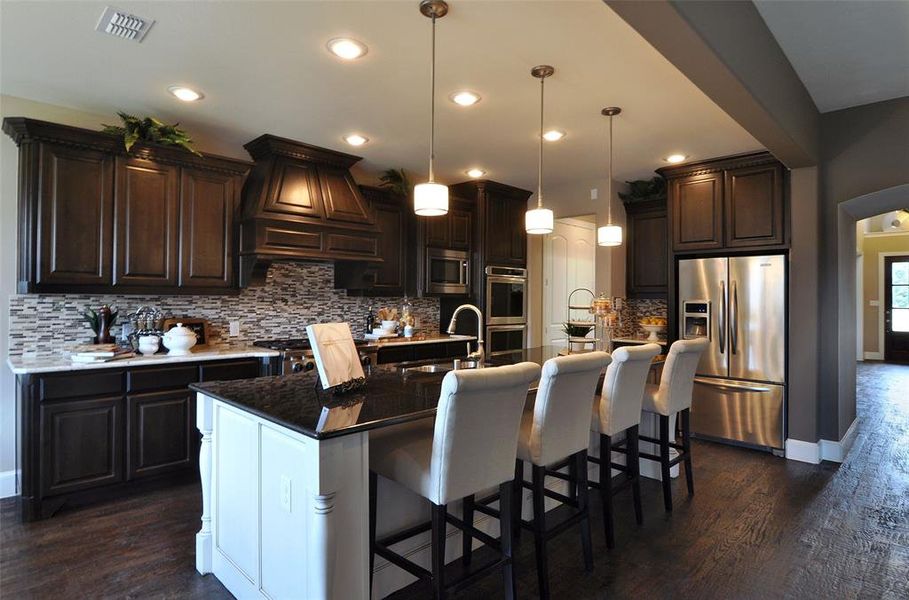 Spacious kitchen with eat-in bartop island Spacious kitchen with eat-in bartop island