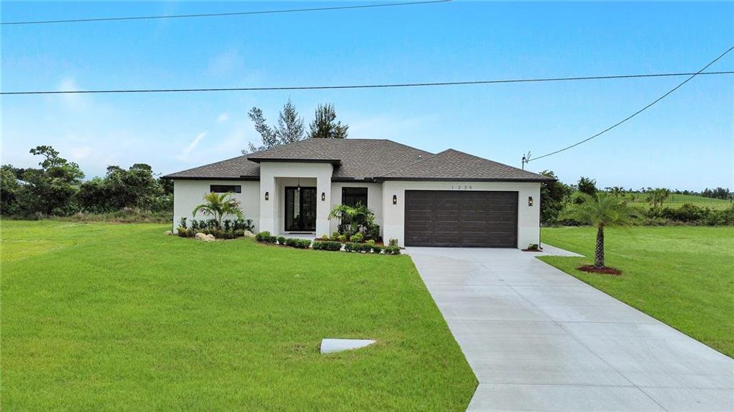 Front exterior of a new home in , Cape Coral, FL, highlighting curb appeal (Image 28).