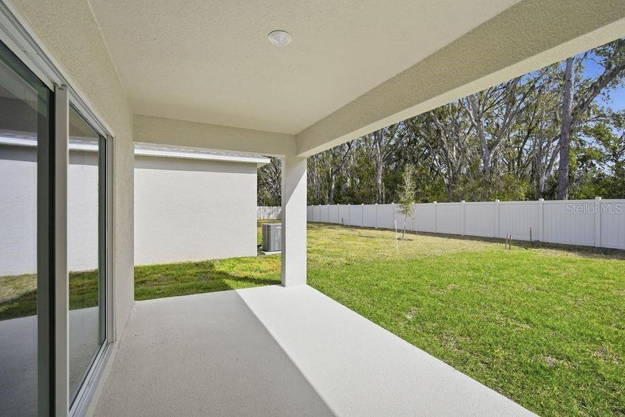 Exterior details and patio area of a home in Palm Wind, Hudson (Image 18). Exterior details and patio area of a home in Palm Wind, Hudson (Image 18).