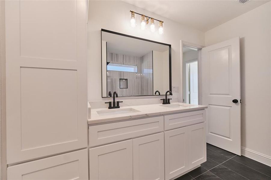 Bathroom with vanity and tile patterned floors