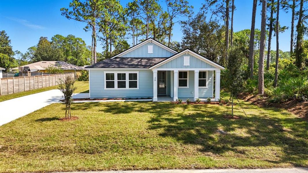 Front exterior of a new home in Palm Coast Homes, Palm Coast, FL, highlighting curb appeal (Image 2).