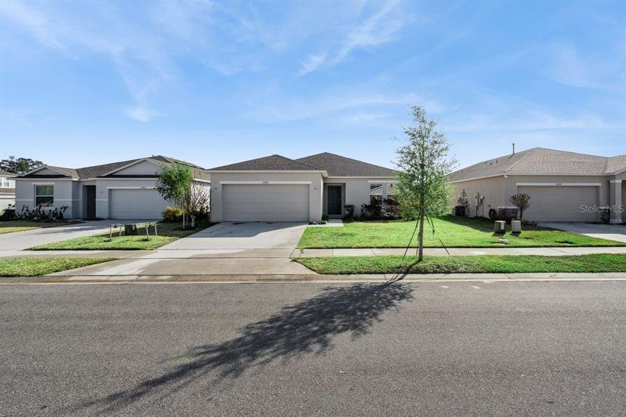 Front exterior of a new home in Liberty Preserve, Leesburg, FL, highlighting curb appeal (Image 1). Front exterior of a new home in Liberty Preserve, Leesburg, FL, highlighting curb appeal (Image 1).
