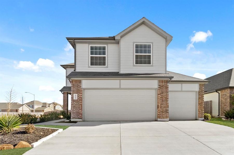 Front exterior of a new home in Retreat at Fossil Creek, Fort Worth, TX, highlighting curb appeal (Image 1). Front exterior of a new home in Retreat at Fossil Creek, Fort Worth, TX, highlighting curb appeal (Image 1).