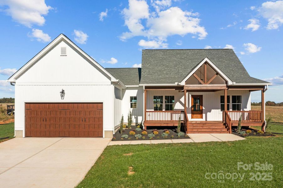 Front exterior of a new home in , Olin, NC, highlighting curb appeal (Image 1). Front exterior of a new home in , Olin, NC, highlighting curb appeal (Image 1).