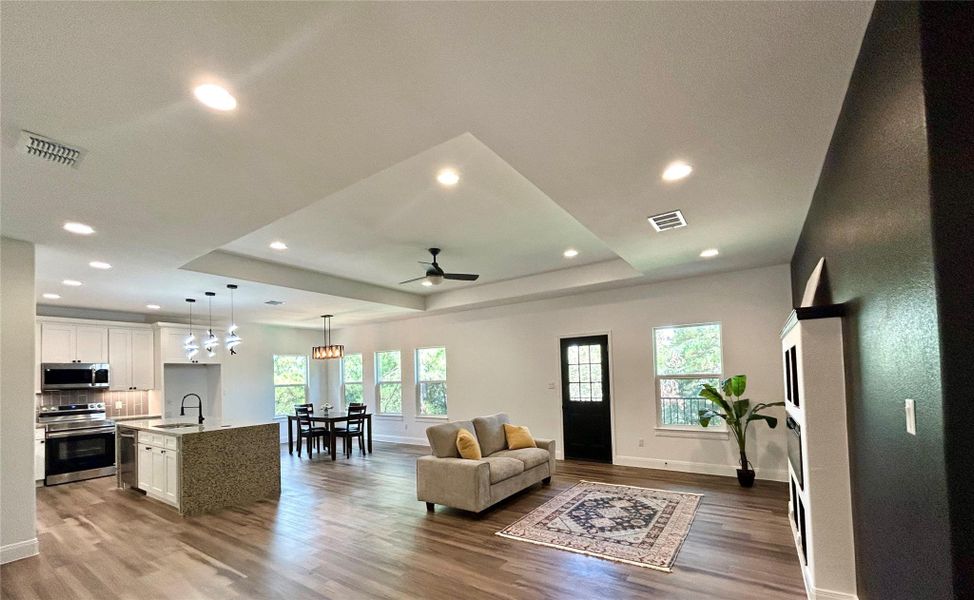 Open concept living, dining, and kitchen areas. Open concept living, dining, and kitchen areas.