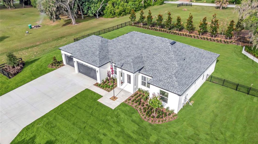 Front exterior of a new home in , Montverde, FL, highlighting curb appeal (Image 1). Front exterior of a new home in , Montverde, FL, highlighting curb appeal (Image 1).