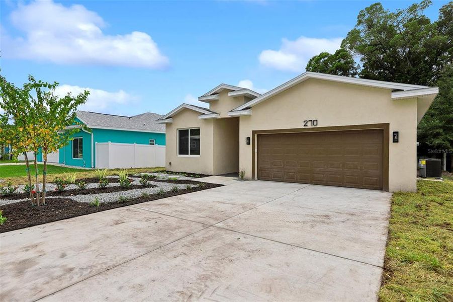 Front exterior of a new home in , Dunedin, FL, highlighting curb appeal (Image 29).
