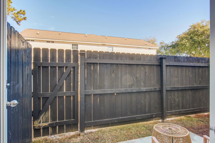 Exterior details and patio area of a home in Clear Springs Townhomes, North Charleston (Image 23).