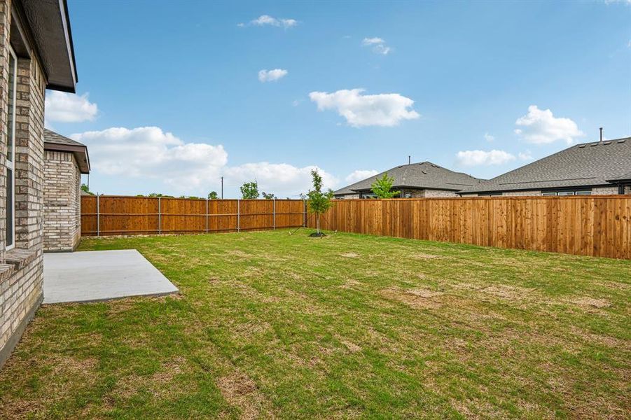 Exterior details and patio area of a home in The Preserve Estates, Justin (Image 19).