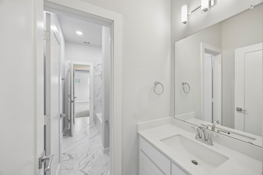 Dual Entry Bathroom in the Picasso II home plan by Trophy Signature Homes – REPRESENTATIVE PHOTO Dual Entry Bathroom in the Picasso II home plan by Trophy Signature Homes – REPRESENTATIVE PHOTO