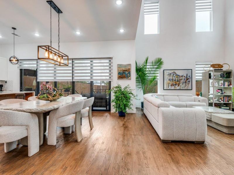 Living room featuring light wood finished floors and recessed lighting