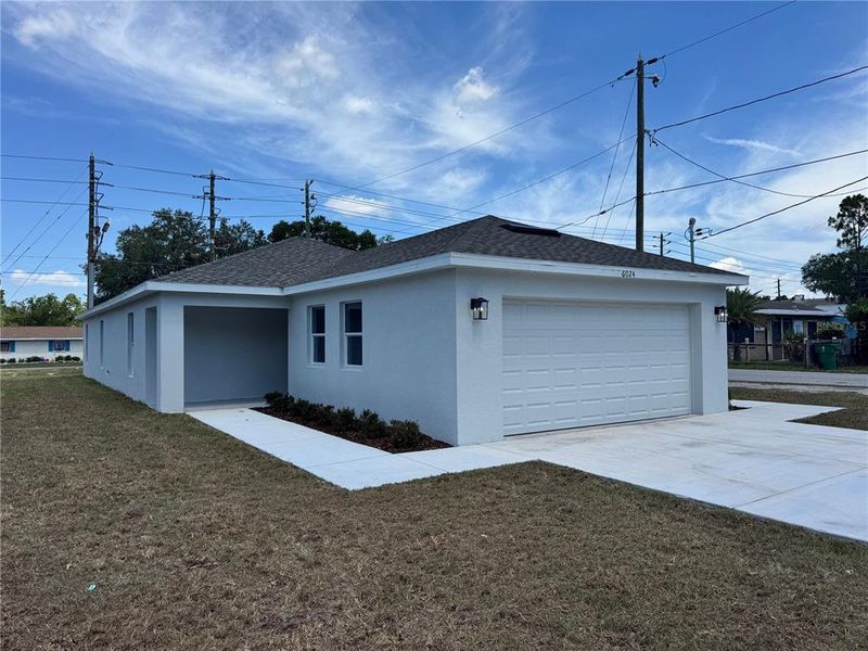 Front exterior of a new home in , Zephyrhills, FL, highlighting curb appeal (Image 25). Front exterior of a new home in , Zephyrhills, FL, highlighting curb appeal (Image 25).