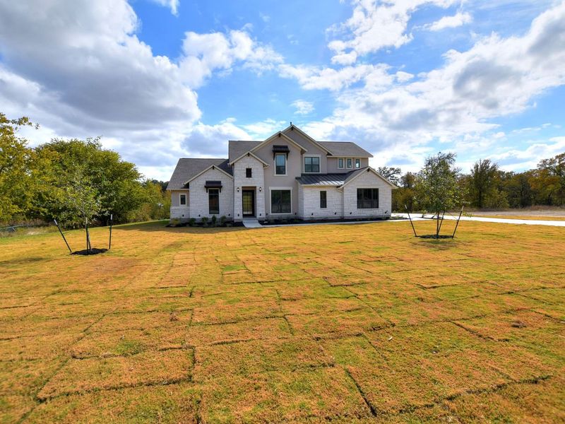 Representative exterior photo of a completed home built from the Madera II by Giddens Homes in Scofield Farms Estates, Georgetown, TX (Image 38).