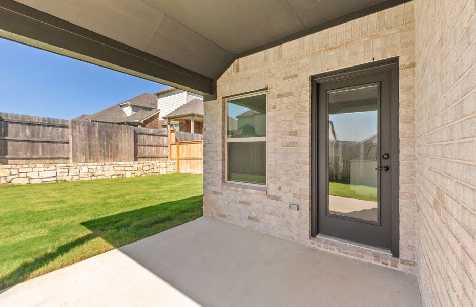 Front exterior of a new home in Crescent Bluff, Georgetown, TX, highlighting curb appeal (Image 25). Front exterior of a new home in Crescent Bluff, Georgetown, TX, highlighting curb appeal (Image 25).