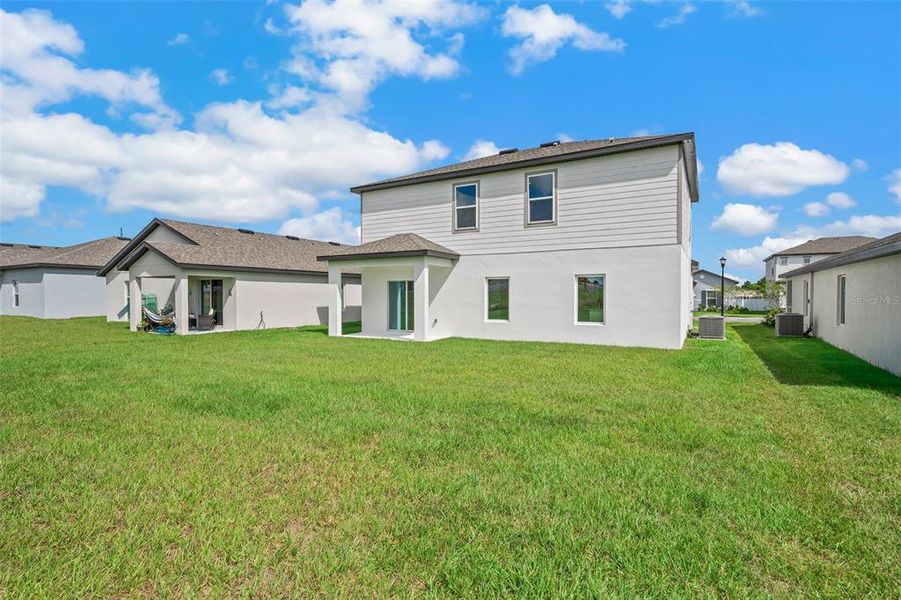 Exterior details and patio area of a home in Peach Crossings, Winter Haven (Image 4).