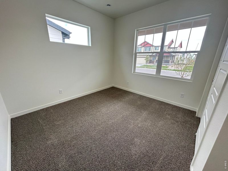 Spacious, unfurnished interior of a new home in Union Colony West, Greeley (Image 8).