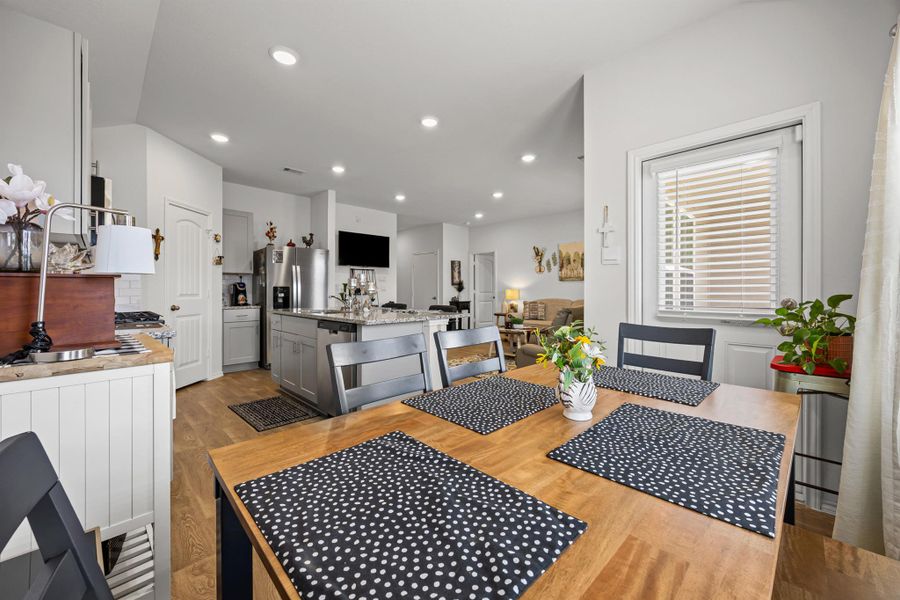 Dining room featuring light wood finished floors and recessed lighting