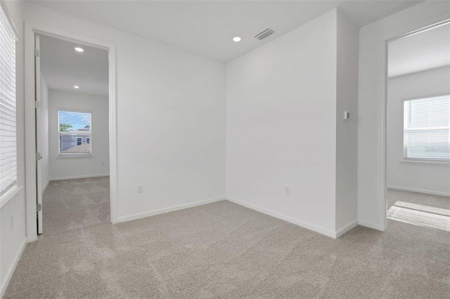 Spacious, unfurnished interior of a new home in Serenade at Ovation, Winter Garden (Image 12).