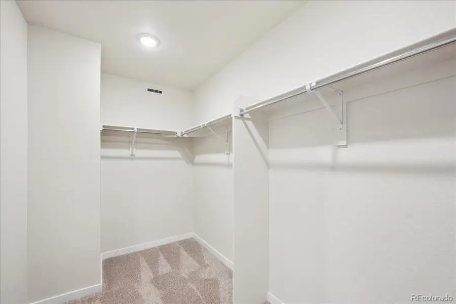 Spacious, unfurnished interior of a new home in Coyote Creek, Fort Lupton (Image 17).