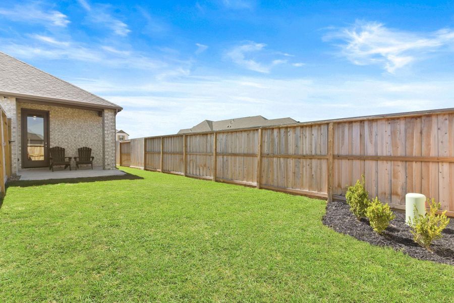 Exterior details and patio area of a home in Riceland: 42ft. lots, Mont Belvieu (Image 26).