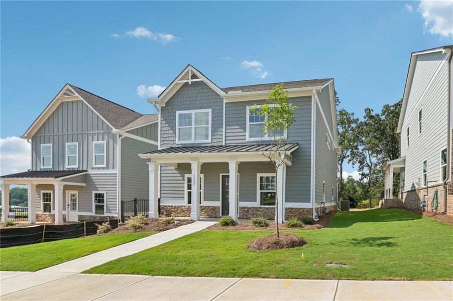 Front exterior of a new home in Magnolia Trace, Flowery Branch, GA, highlighting curb appeal (Image 16).