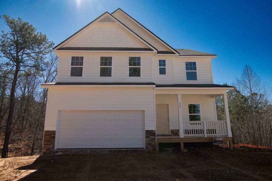 Front exterior of a new home in Creekside Landing, Dallas, GA, highlighting curb appeal (Image 1). Front exterior of a new home in Creekside Landing, Dallas, GA, highlighting curb appeal (Image 1).