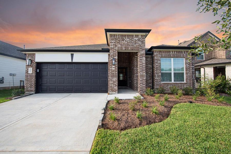 Front exterior of a new home in Bluestem, Brookshire, TX, highlighting curb appeal (Image 1). Front exterior of a new home in Bluestem, Brookshire, TX, highlighting curb appeal (Image 1).