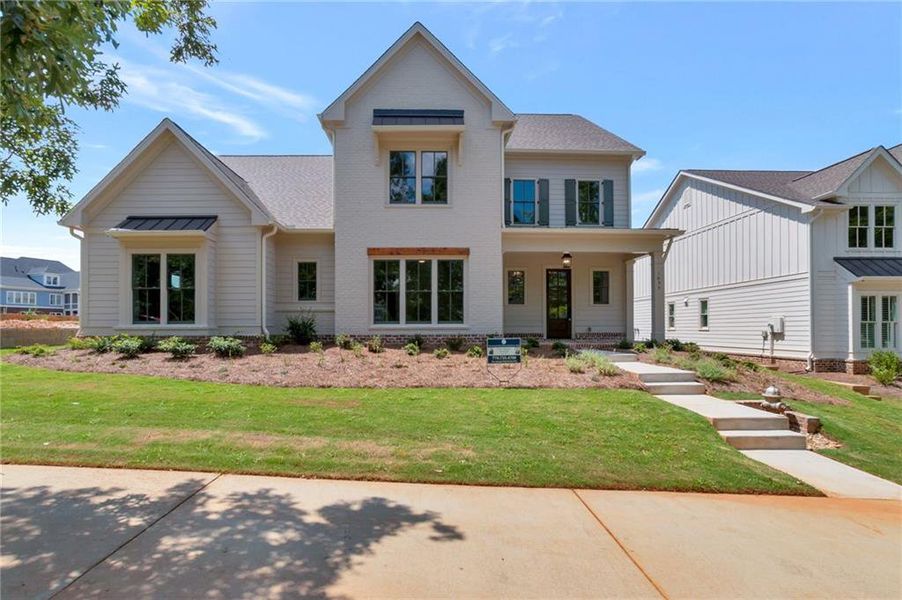 Front exterior of a new home in , Statham, GA, highlighting curb appeal (Image 27).