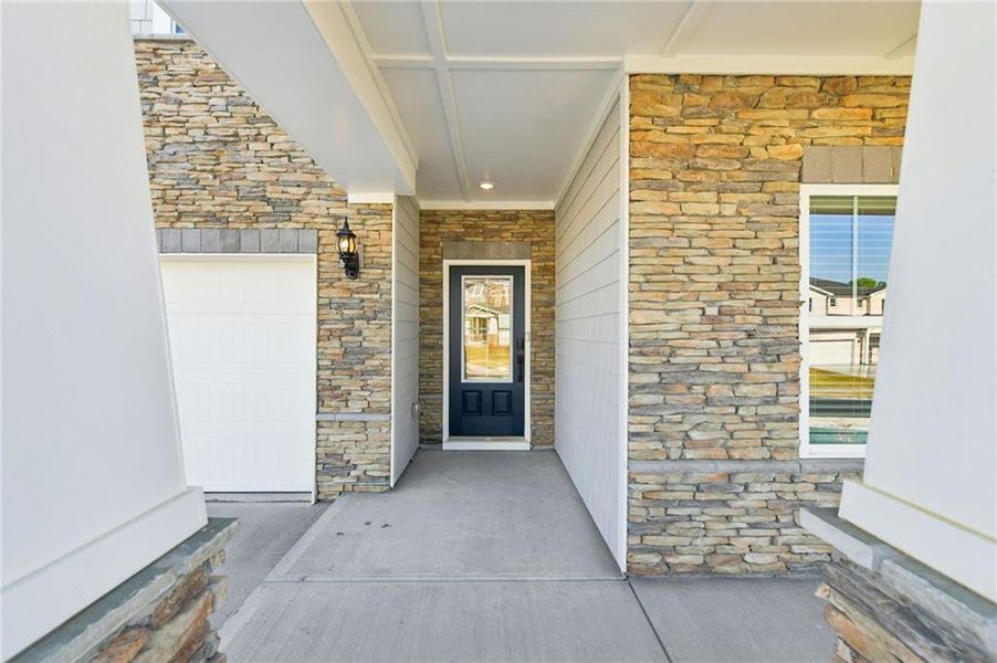 Exterior details and patio area of a home in Vines at Mill Creek - Estate Series, Braselton (Image 4).