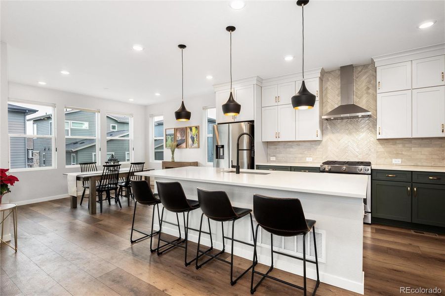 The two-toned designer cabinets add to the polished and refined interior.