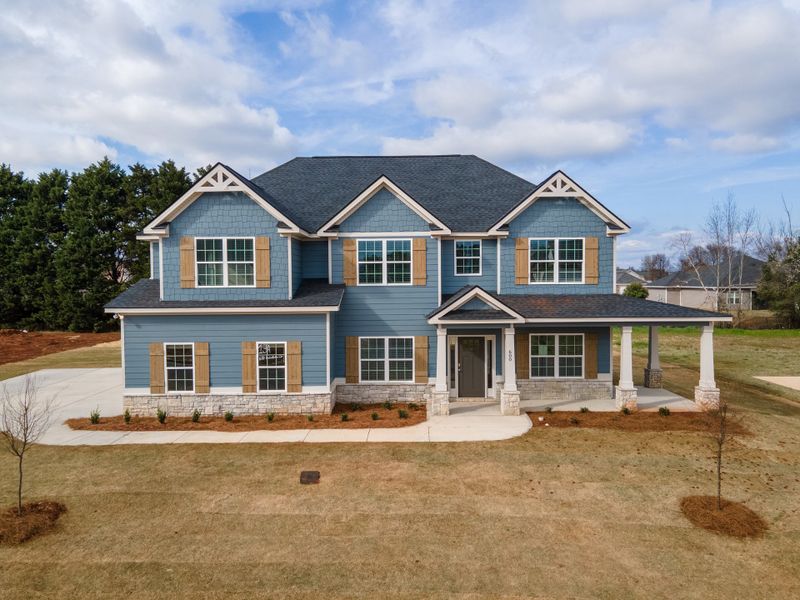 Representative exterior photo of a completed home built from the Cypress by Hughston Homes in Juliette Crossing, Forsyth, GA (Image 23).