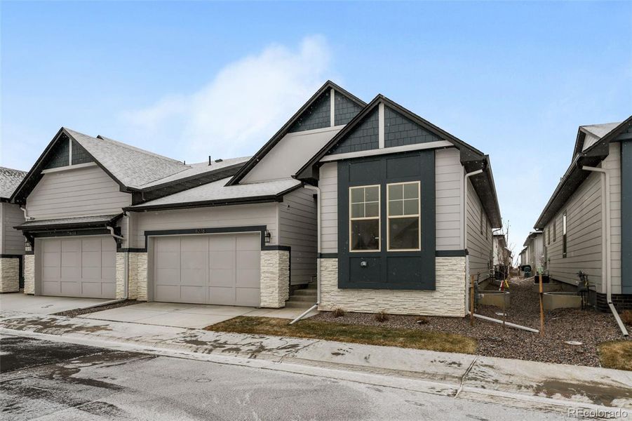 Front exterior of a new home in Deer Creek, Littleton, CO, highlighting curb appeal (Image 26).