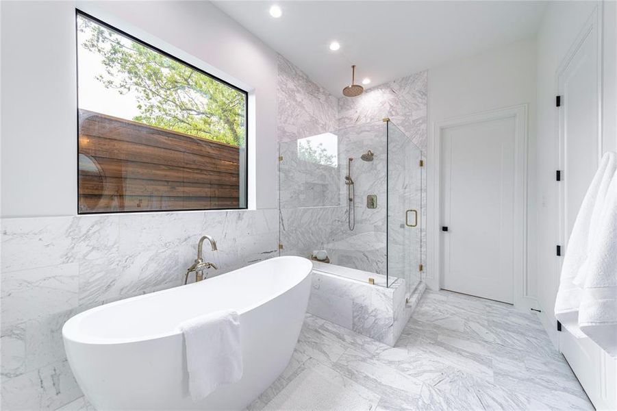 Bathroom with a soaking tub, a marble finish shower, recessed lighting, tile walls, and light marble finish flooring