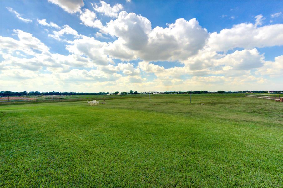 Expansive backyard offering endless space for recreation or future outdoor additions