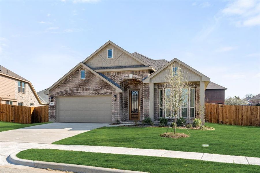 Front exterior of a new home in Sable Creek, Sanger, TX, highlighting curb appeal (Image 1). Front exterior of a new home in Sable Creek, Sanger, TX, highlighting curb appeal (Image 1).