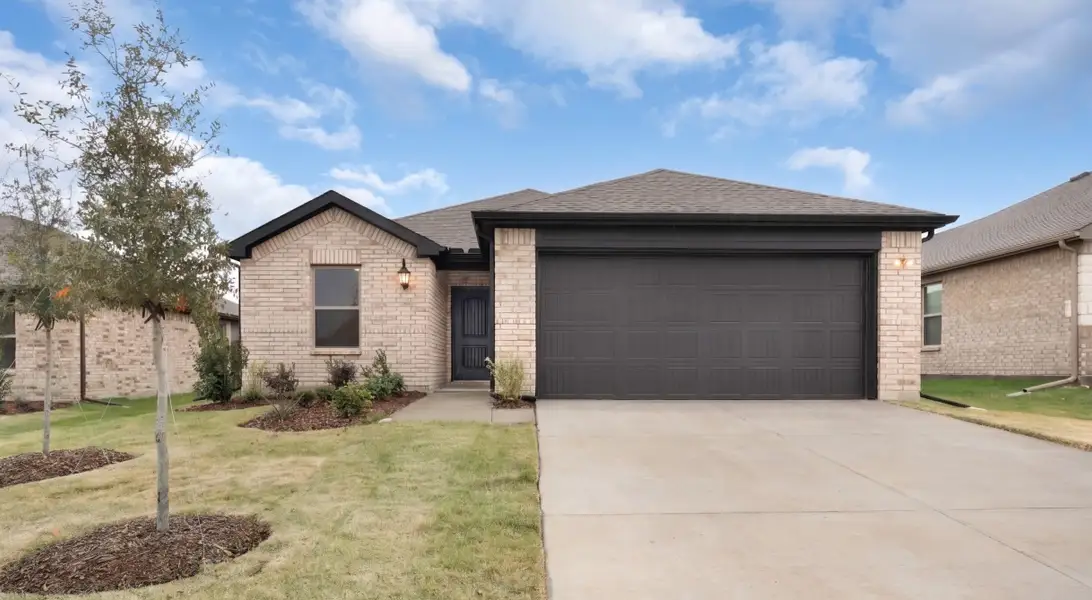 Front exterior of a new home in Stonecreek, Sulphur Springs, TX, highlighting curb appeal (Image 1). Front exterior of a new home in Stonecreek, Sulphur Springs, TX, highlighting curb appeal (Image 1).
