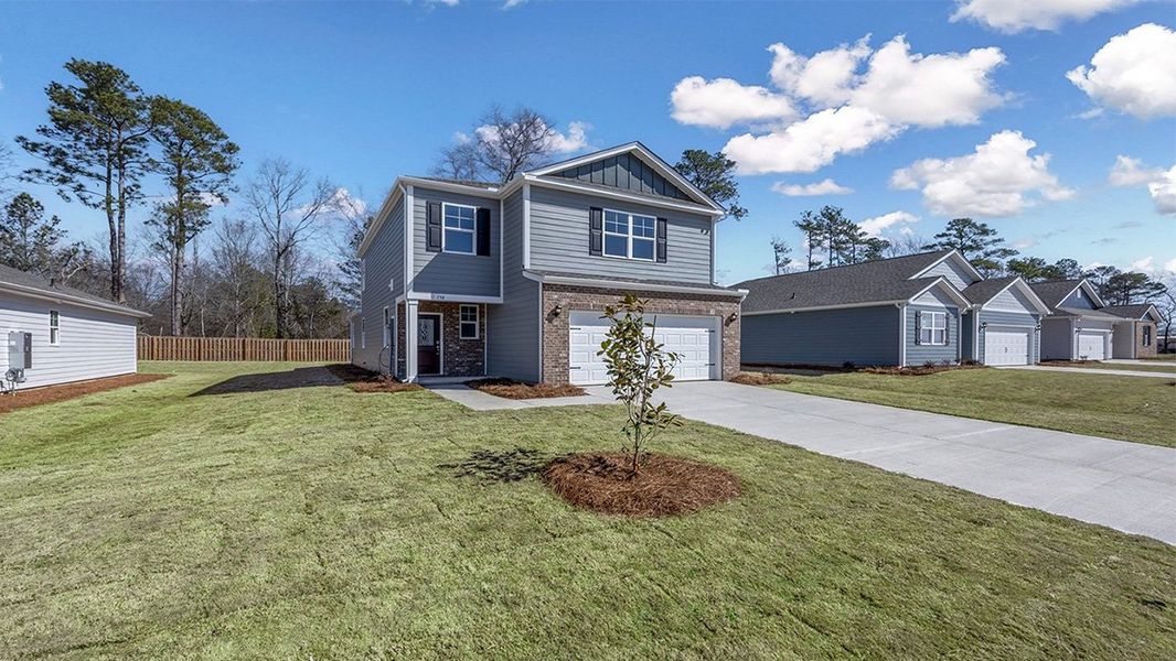 Front exterior of a new home in Sease's Pond, Gilbert, SC, highlighting curb appeal (Image 20).